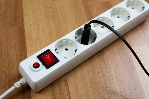 White extension cord with multiple outlets and single red switch and plug f.. Stock Photos