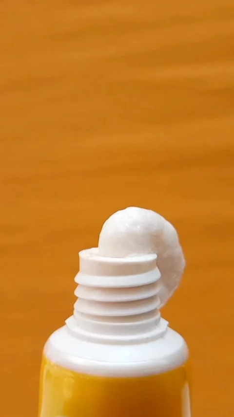 White Eye Cream Texture Squeezed from Tube on Yellow Background, Skincare Stock Footage 328291864