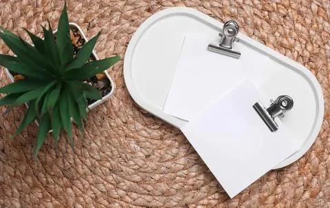 White eye patch on a woven mat with plant 写真素材