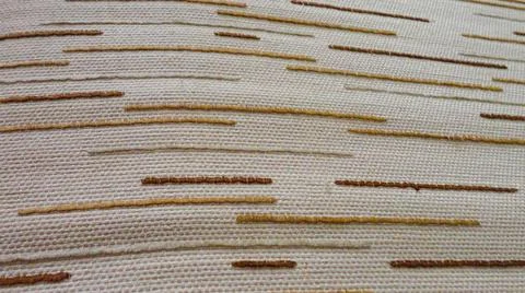 White fabric background with tiny brown lines. Close-up white cotton texture 写真素材
