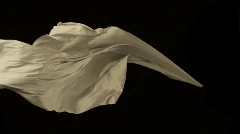 White fabric flowing on black background, Slow Motion Stock Footage 25854101