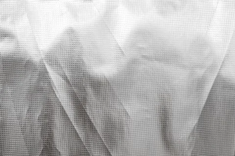 A white fabric with a pattern of squares and triangles 스톡 사진