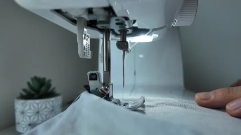 White fabric puckering under sewing machine during stitching Video stock 333306746