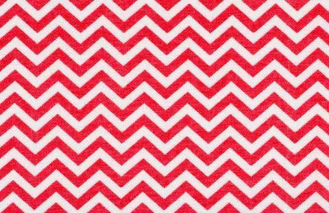 White fabric with a red chevron pattern White fabric with a red chevron pa... Foto stock