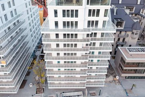 White facade of a modern multi-storey building. View from above Stock Photos
