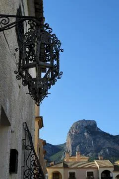 White facade with wrought iron lantern in Polop village Stock Photos