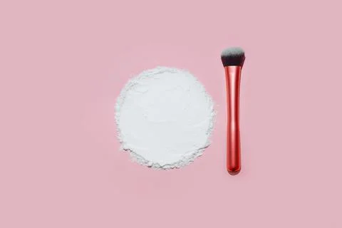 White face powder with empty circle inside on pink background Stock Photos