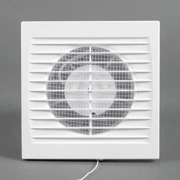 White fan on a gray background. Ventilation system. Stock Photos