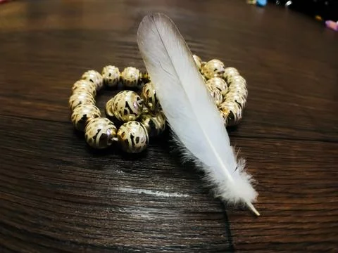 White feather on blur background Stock Photos