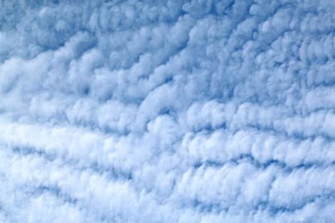 White feather clouds in the sky Stock Photos