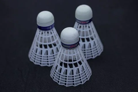 White Feather Shuttlecock on Plain Surface Stock Photos