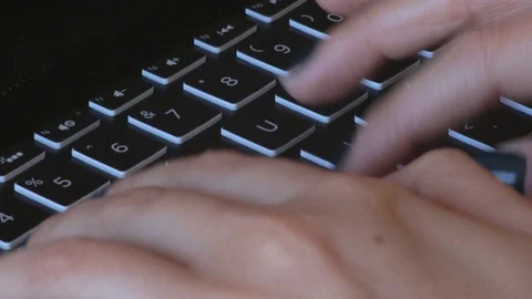 White female typing on a laptop while working from home Stock Footage 124353005