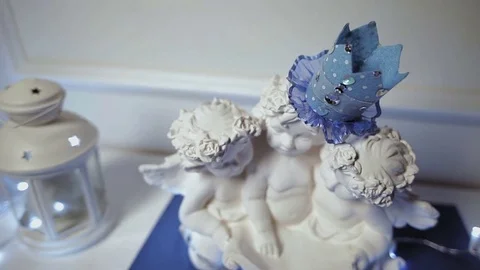 The white figures of three angels and candle holder decorate the interior Stock Footage 77626536