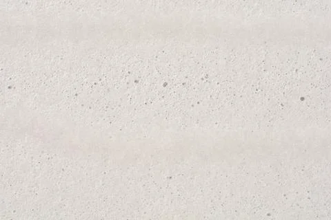 White fine foam texture with tiny bubbles. Stock Photos