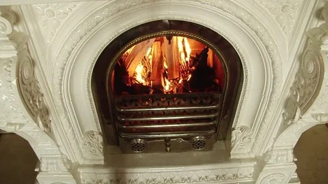 White fireplace in which the fire burns top view Stock Footage 69143731