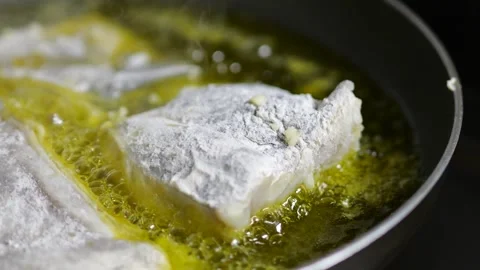White Fish Fillets Cooking in Hot Olive Oil Stock Footage 341679004