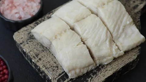 White fish fillets, seafood cooked with salt and spices. Fish fillets Stock Footage 311887342