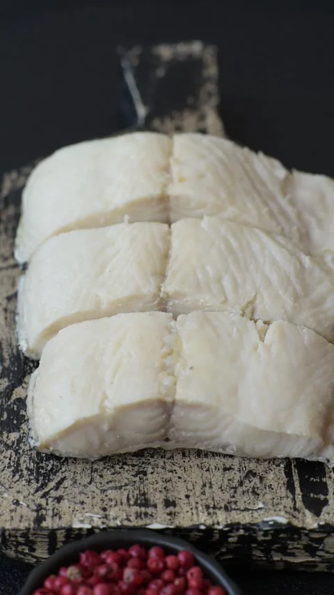White fish fillets, seafood cooked with salt and spices. Fish fillets Stock Footage 311887347