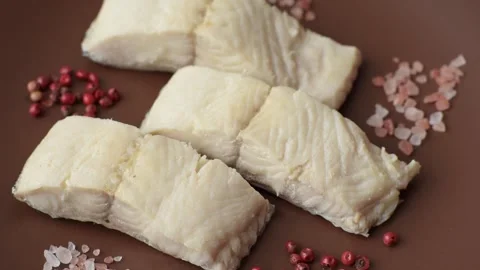 White fish fillets, seafood cooked with salt and spices. Fish fillets Stock Footage 311887357