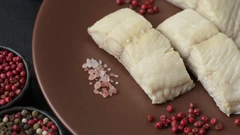 White fish fillets, seafood cooked with salt and spices. Fish fillets Stock Footage 311887369