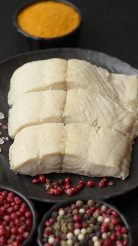 White fish fillets, seafood cooked with salt and spices. Fish fillets Stock Footage 311887386
