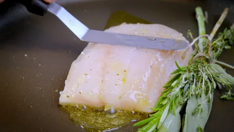 White fish pike-perch, zander are fried in a pan in hot olive oil. Video stock 274463610