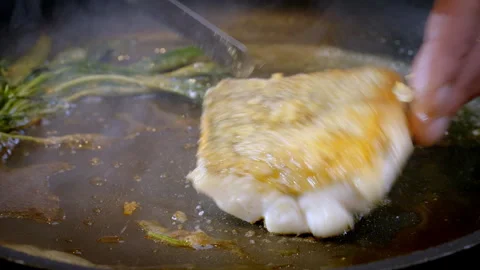 White fish pike-perch, zander are fried in a pan in hot olive oil. Video stock 277452437