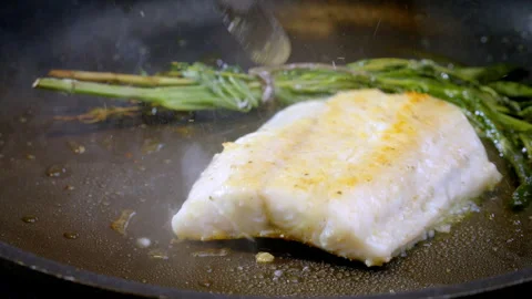 White fish pike-perch, zander are fried in a pan in hot olive oil. Stock Footage 288482942