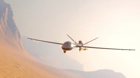 White fixed-wing drone banking over desert dunes at golden hour Stockbeeldmateriaal 104426632