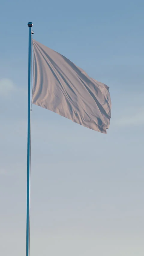 White Flag: Cinematic Vertical Waving Flag Against Blue Sky Video stock 323321667