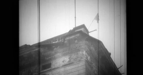 White flag flying from wrecked building Stock Footage 43455200
