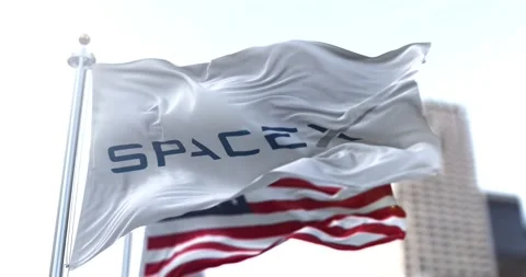 White flag with the SpaceX logo flapping in the wind Stock Footage 150150764