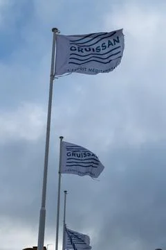 White Flags Beneath Cloudy Sky Stock Photos
