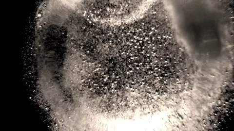 White Flakes of Bubbles Continuously Swirling on Background of Infinite Darkness Stock Footage 76390740