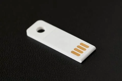 White flash drive on drak background (selective focus) Stock Photos