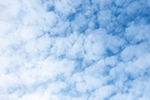 White fleecy clouds in blue sky, altocumulus fluffy clouds background Stock-Fotos