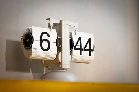 A white flip watch with numerals Stock Photos
