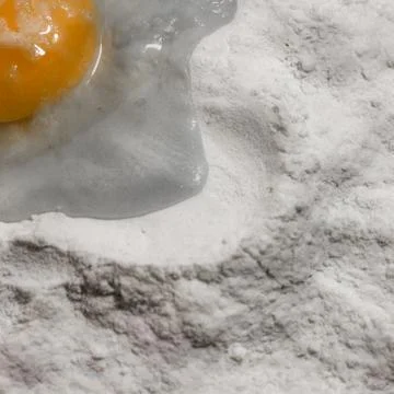 White flour and eggs yolk protein isolated on white background Stock Photos