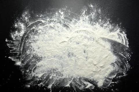 White flour on black background Stock Photos