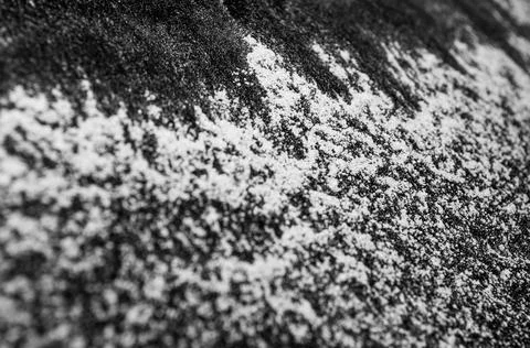 White flour on a black background, texture . Stock Photos