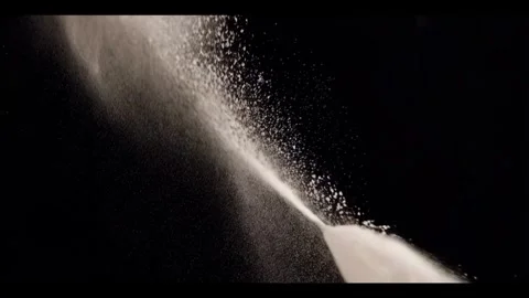 White flour crumbles on black background Stock Footage 286291799