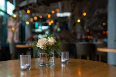 White flower decor at rustic wedding at large restaurant Photos