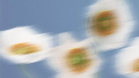 White flowers blooming on a blue background with strong dynamic motion blur.. Stock Footage 337110885