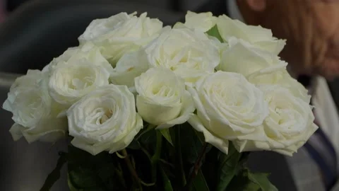 White flowers placed on the late Senator Lindsey Graham's seat Stock Footage 345284055
