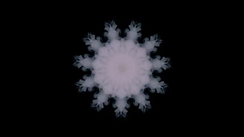 A white fluffy abstract snowflake is dancing on a black background 動画素材 317426468