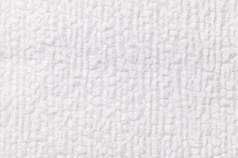 White fluffy background of soft, fleecy cloth. Texture of textile closeup. Stock-Fotos