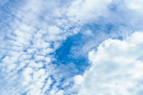 White fluffy cloud and blue sky in sunny day Stock Photos