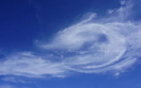 White fluffy cloud in the blue sky Stock Photos