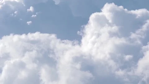 White fluffy cloud changing shape on gray cloudy sky Stock Footage 243171742