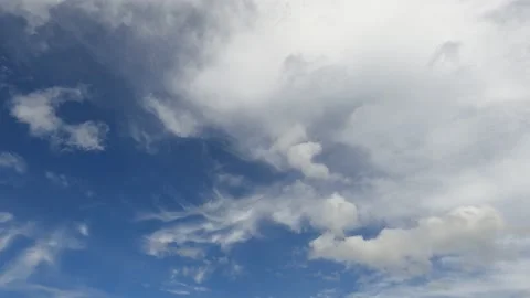 White fluffy cloud n cumulus cloudscape on dark navy blue sky Stock Footage 167766698